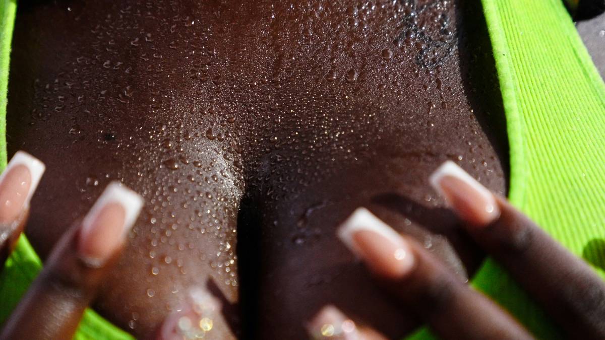 Woman applying scented body lotions fragrances after pre-layering aromatic oil on pulse points