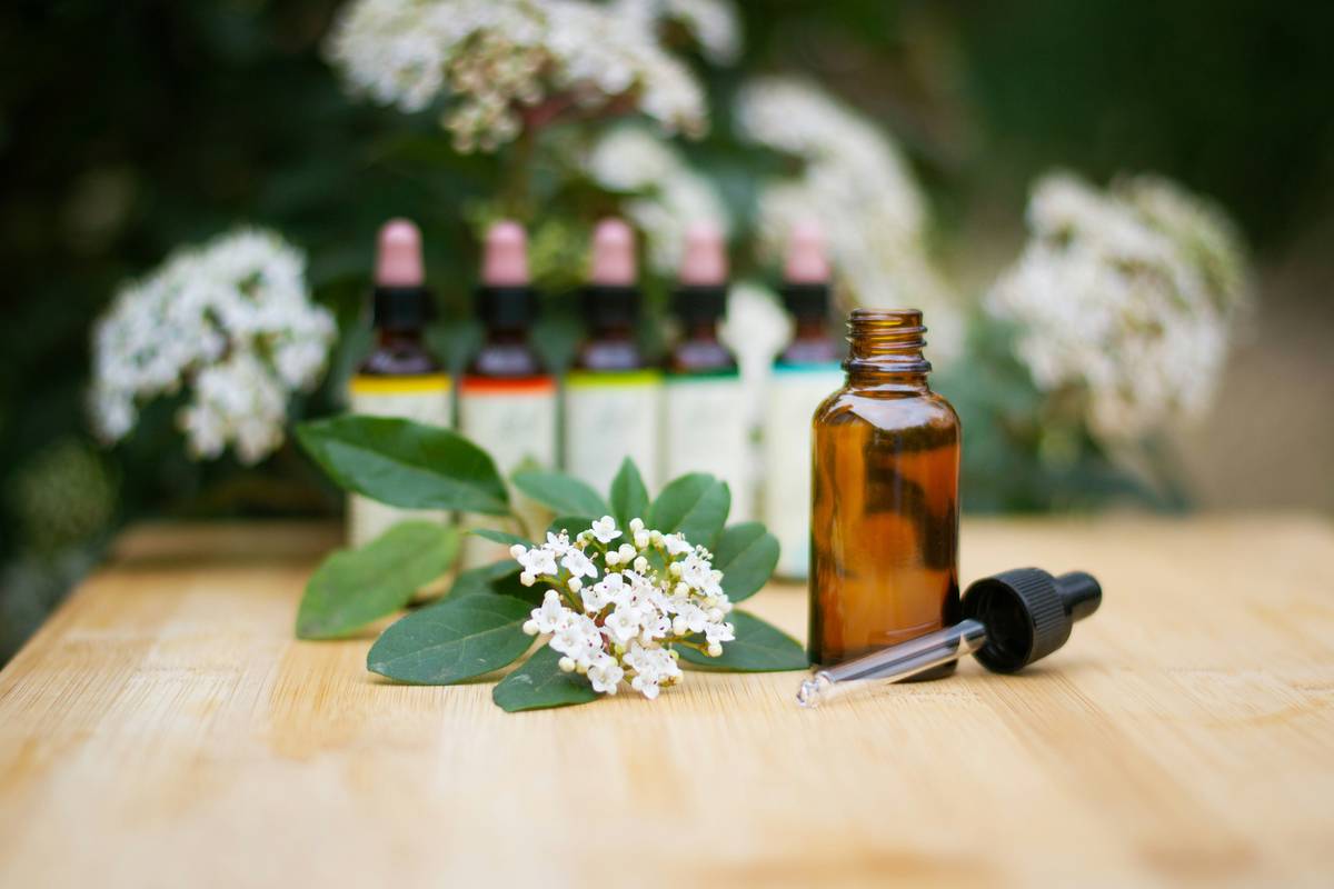 Woman applying be scented fragrance oils to pulse points for long-lasting aroma