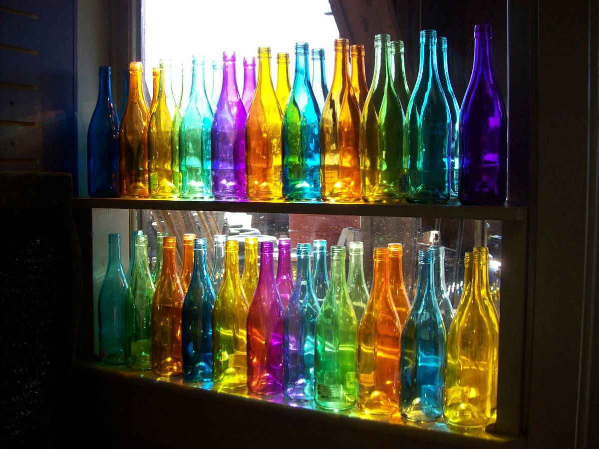 Finished amber bottles of handmade scented oils labeled with custom blend names showing how to make scented oils professionally