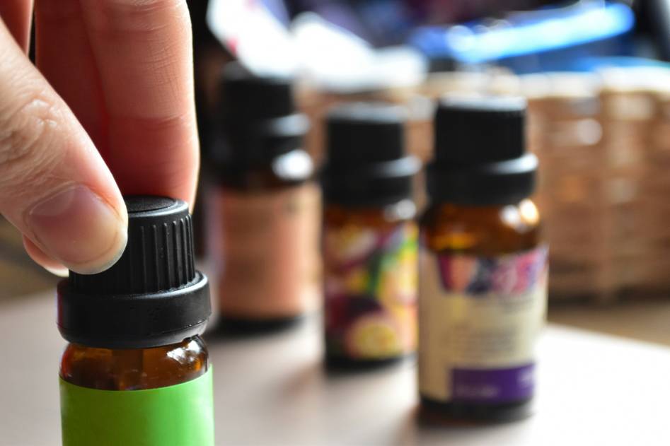 Glass dropper bottle of lavender scented oil on marble